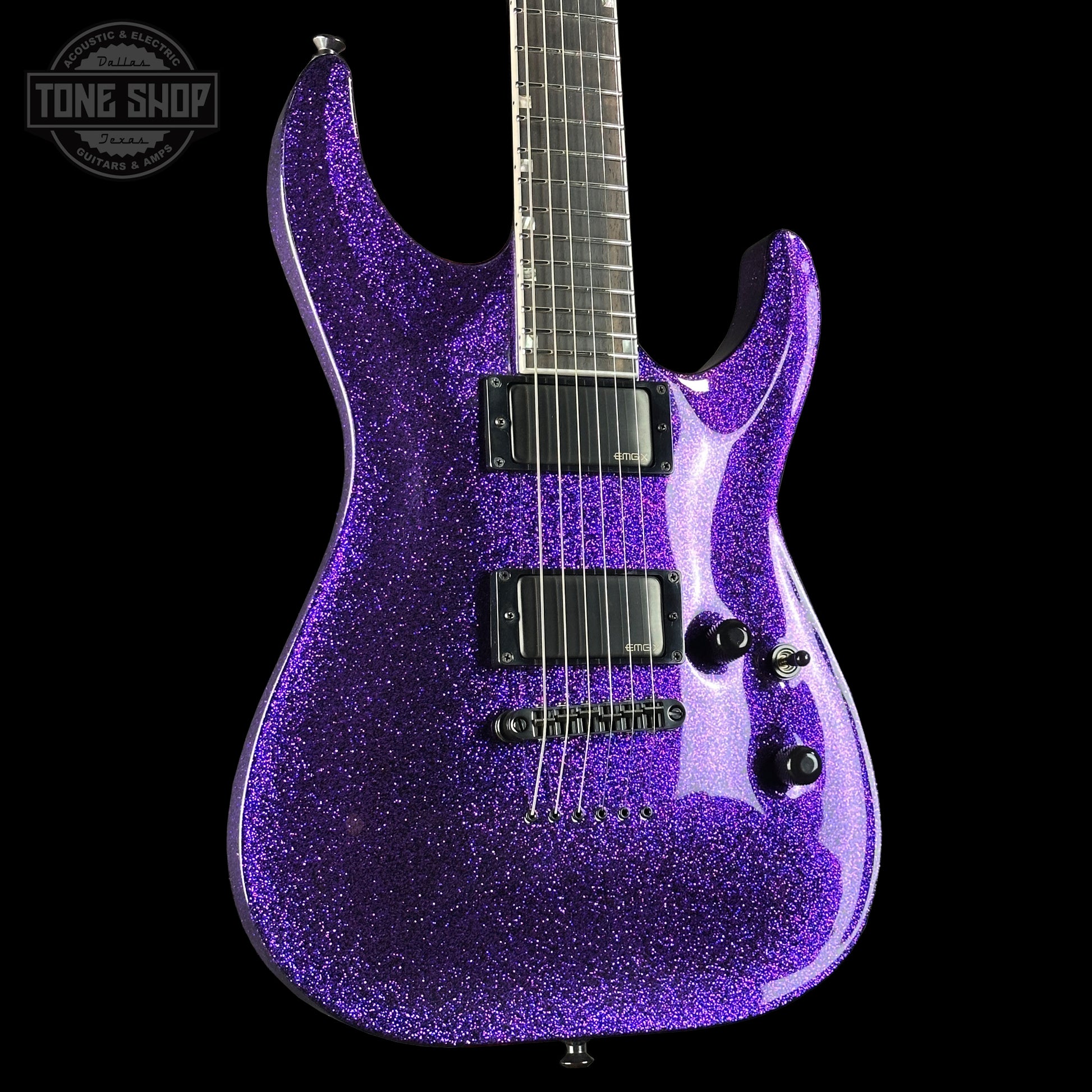 Purple glitter electric guitar on a black background with 'Tone Shop' logo.