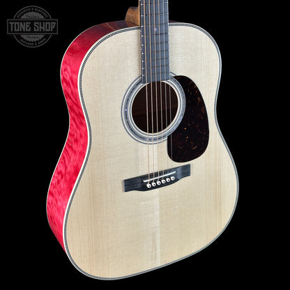 Acoustic guitar with red binding on a black background, featuring 'Tone Shop' logo.