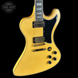 Yellow electric guitar with a black pickguard on a white background, featuring the Tone Shop logo.