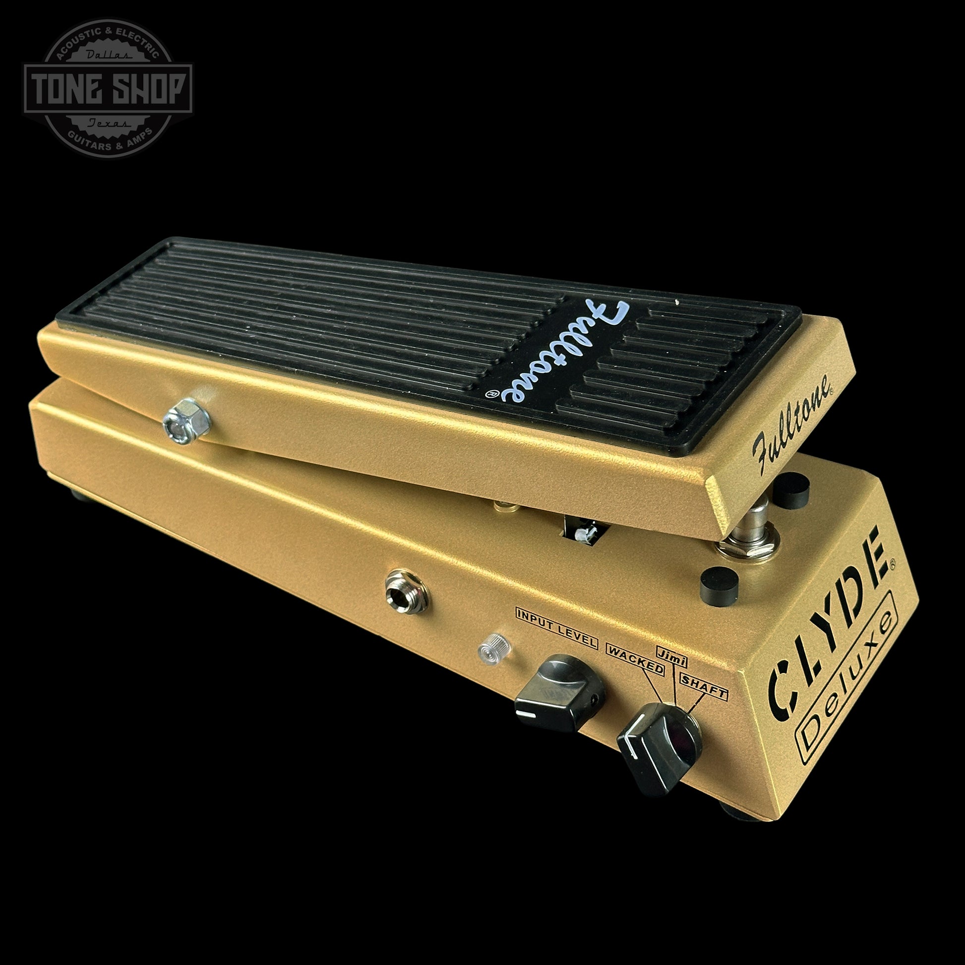 Gold guitar pedal with 'Fulltone' branding on a black background