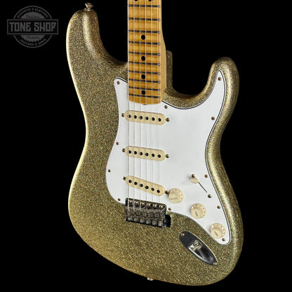 Gold glitter electric guitar with a 'Tone Shop' logo in the corner.