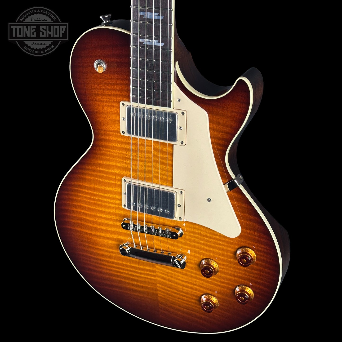 Electric guitar with a sunburst finish on a black background, featuring the Tone Shop logo.