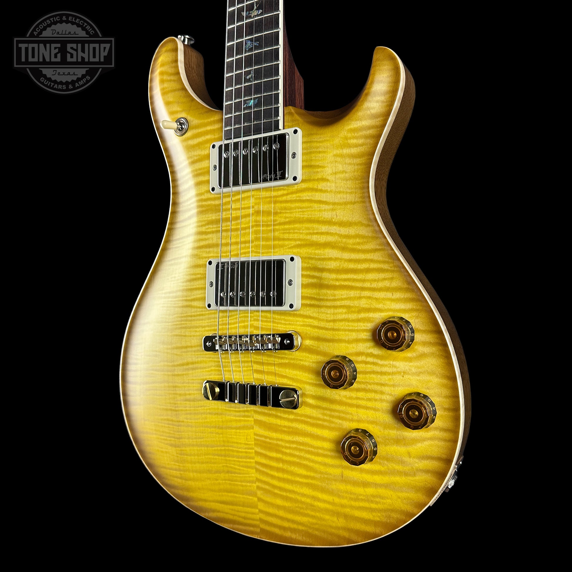 Yellow electric guitar with a black background