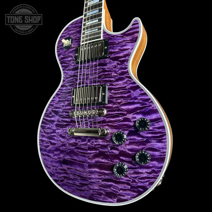 Purple electric guitar with a wavy finish on a black background, featuring 'Tone Shop' branding.