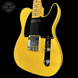 Yellow electric guitar on a black background with 'Tone Shop' logo.