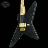 Black electric guitar with gold hardware on a black background, featuring 'Tone Shop' logo.