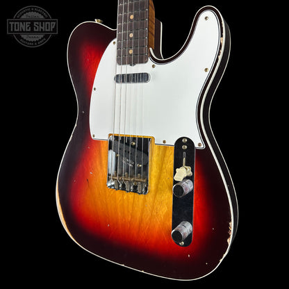 Electric guitar with a sunburst finish on a black background, featuring the Tone Shop logo.