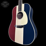 Acoustic guitar with a red, white, and blue striped design on a black background.