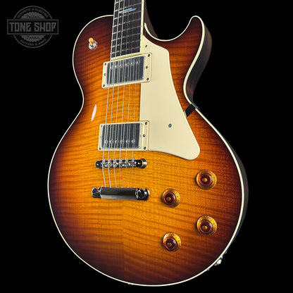 Electric guitar with a sunburst finish on a black background, featuring the Tone Shop logo.