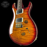 Front angle of PRS Wood Library Custom 24 Quilt 10 Top Dark Cherry Sunburst.
