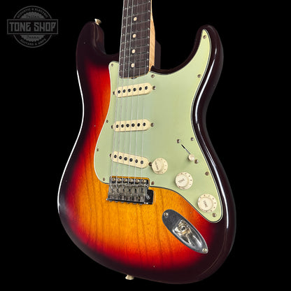 Electric guitar with a sunburst finish on a black background, featuring the Tone Shop logo.