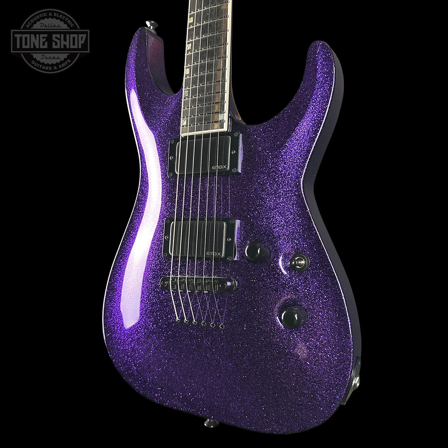 Purple glitter electric guitar on a black background with 'Tone Shop' logo.