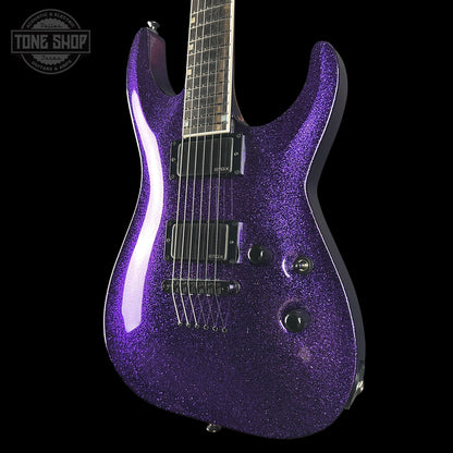 Purple glitter electric guitar on a black background with 'Tone Shop' logo.