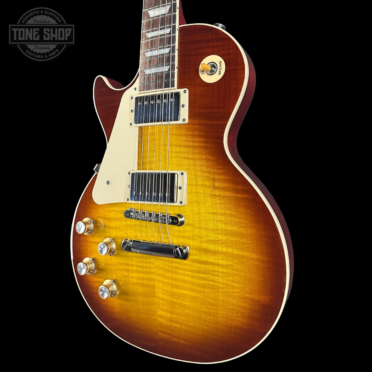 Electric guitar with a sunburst finish on a black background, featuring the Tone Shop logo.