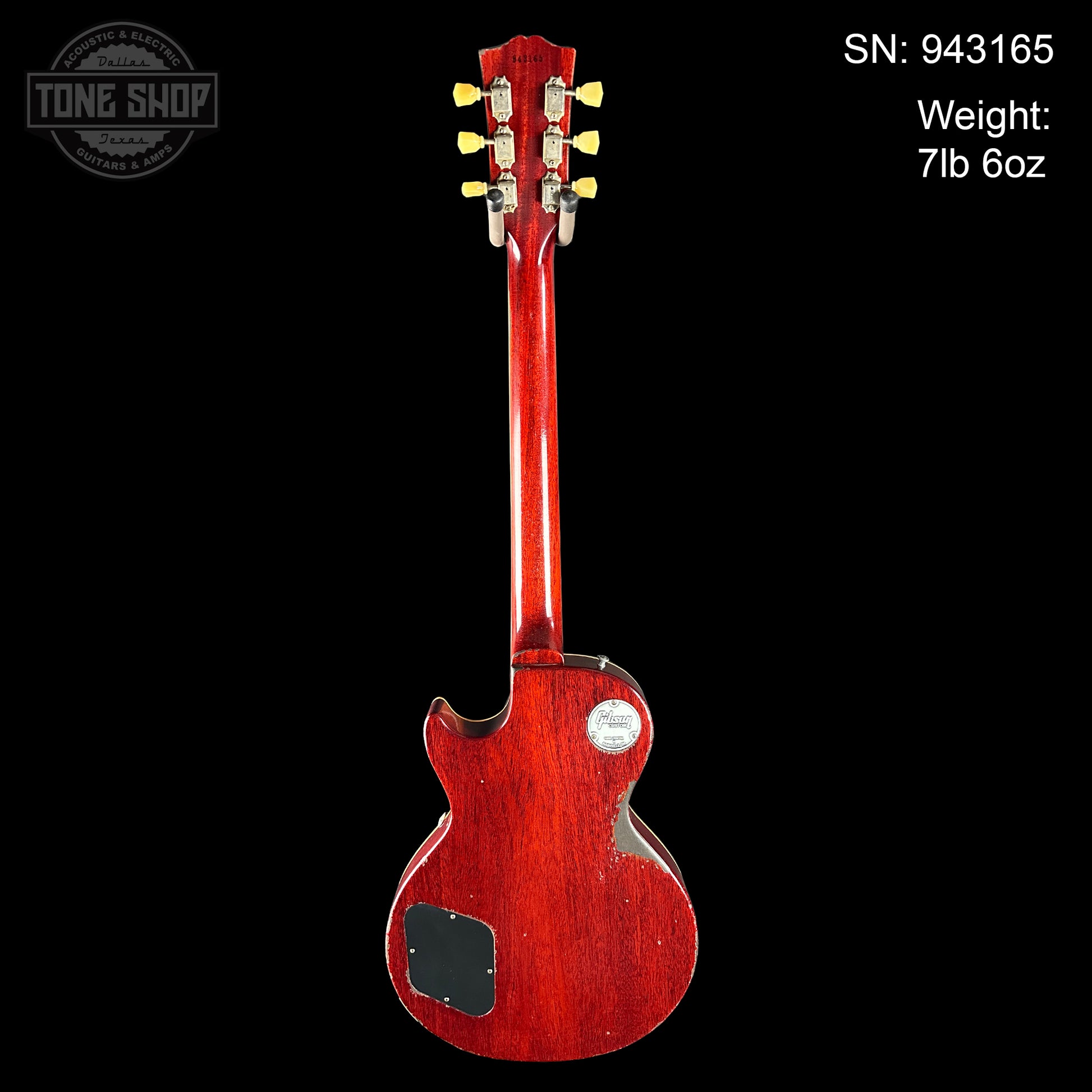 Red electric guitar on a black background with 'Tone Shop' branding.