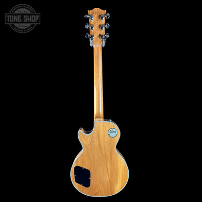 Wooden electric guitar on a black background with 'Tone Shop' logo.