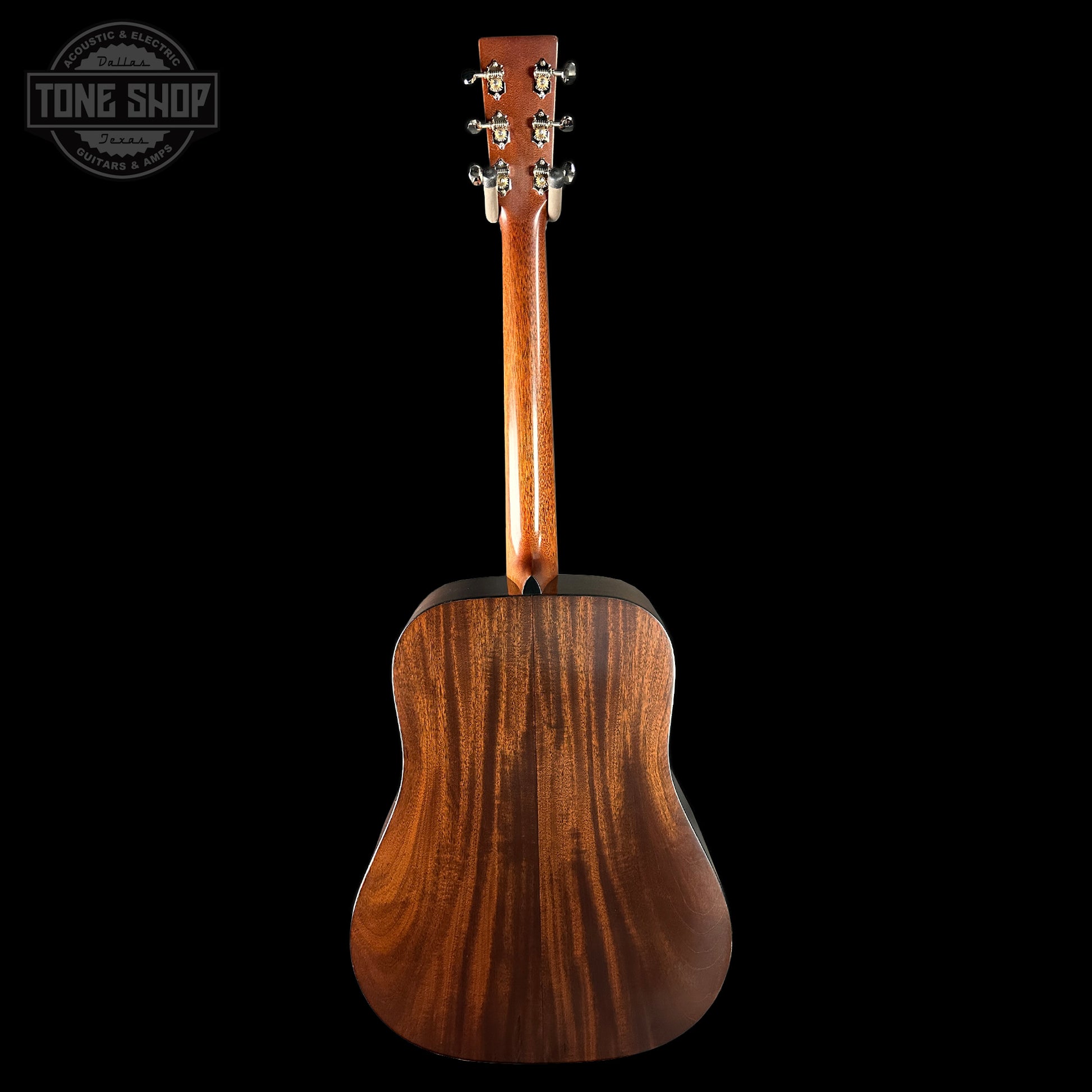 Wooden acoustic guitar on a black background with 'Tone Shop' logo.