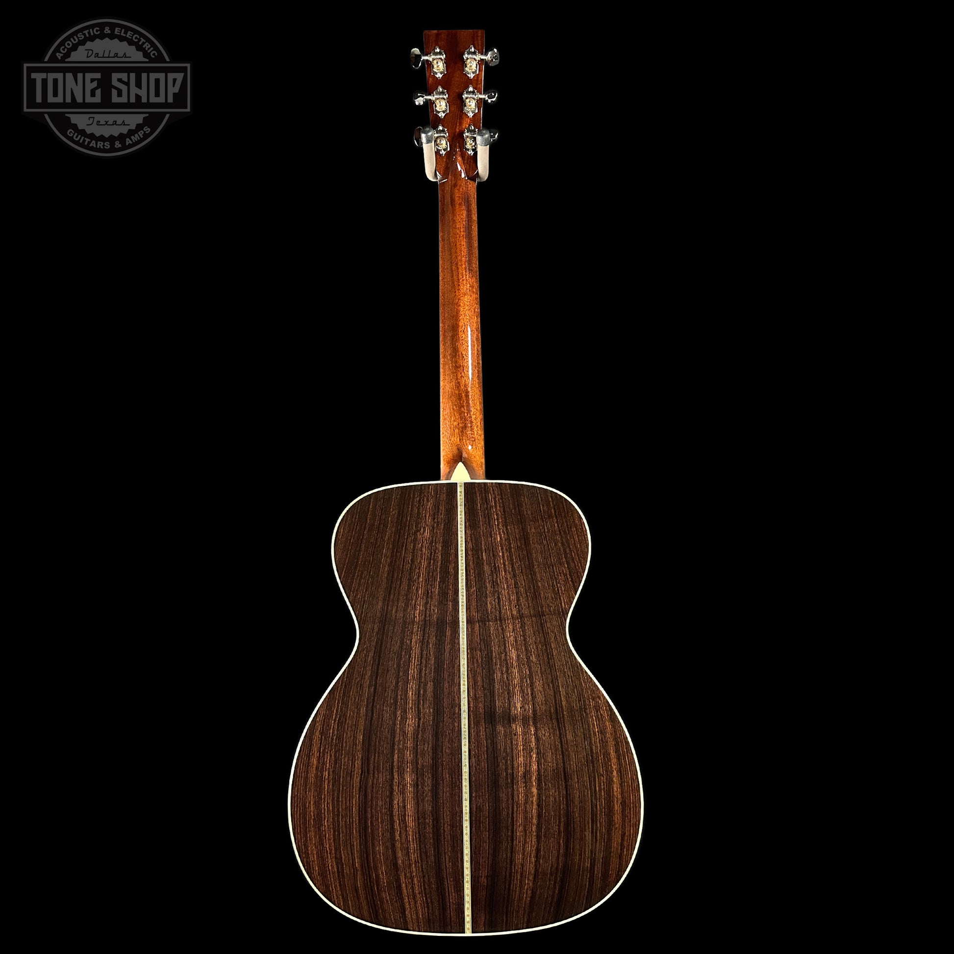 Wooden acoustic guitar on a black background with 'Tone Shop' logo.