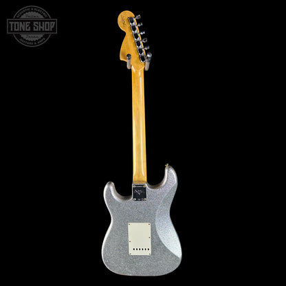 Silver glitter electric guitar with a black background