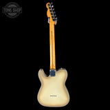 Back view of a guitar with a clear finish on a white background