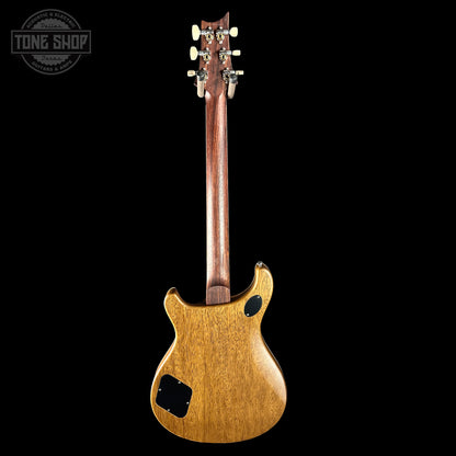 Back view of a wooden electric guitar on a black background with 'Tone Shop' logo.