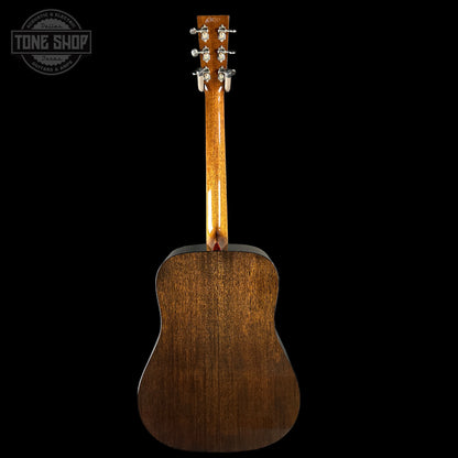 Back view of a wooden acoustic guitar with 'Tone Shop' logo.