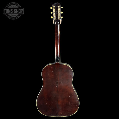 Back view of a vintage acoustic guitar with 'Tone Shop' logo.