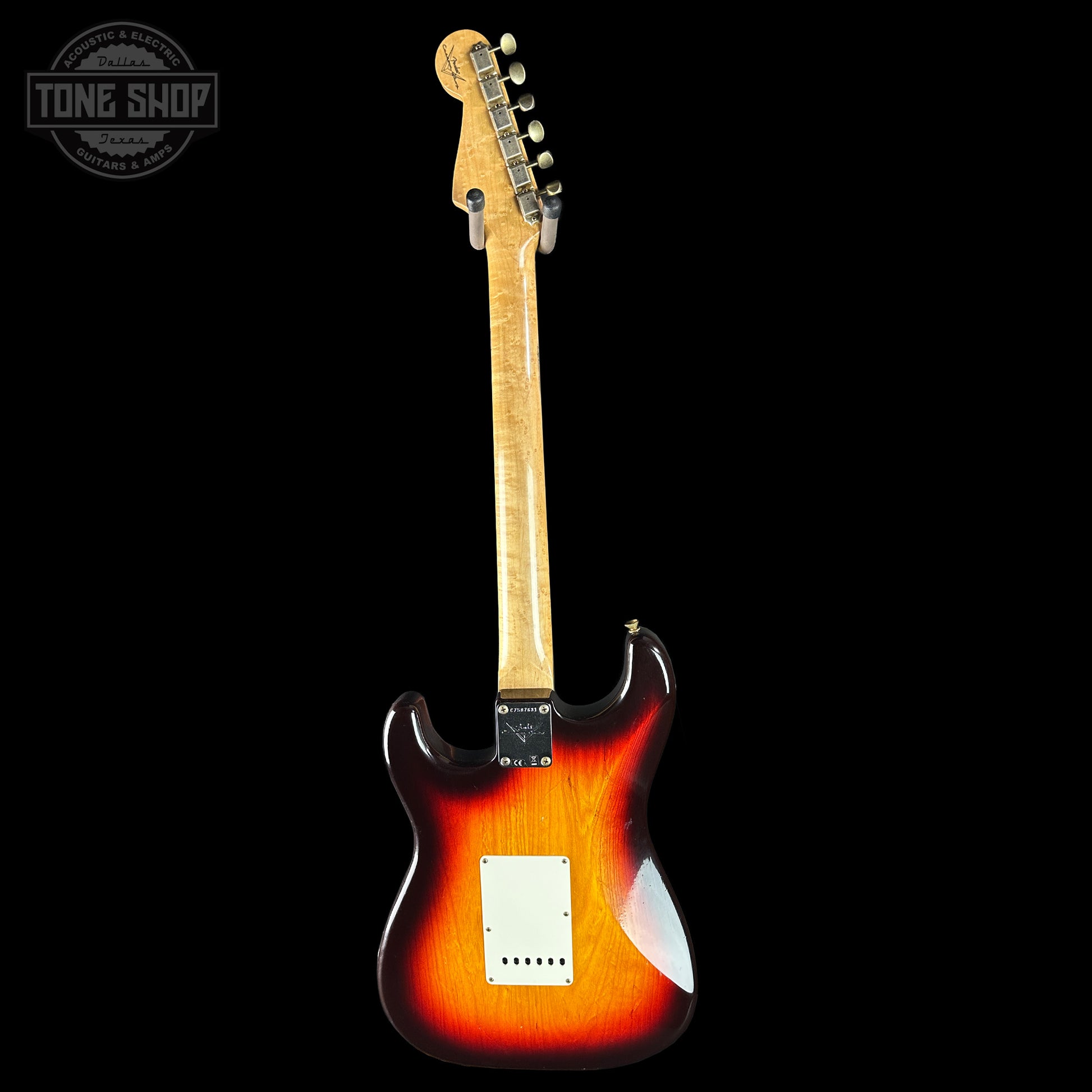 Electric guitar with a sunburst finish on a black background, featuring the Tone Shop logo.
