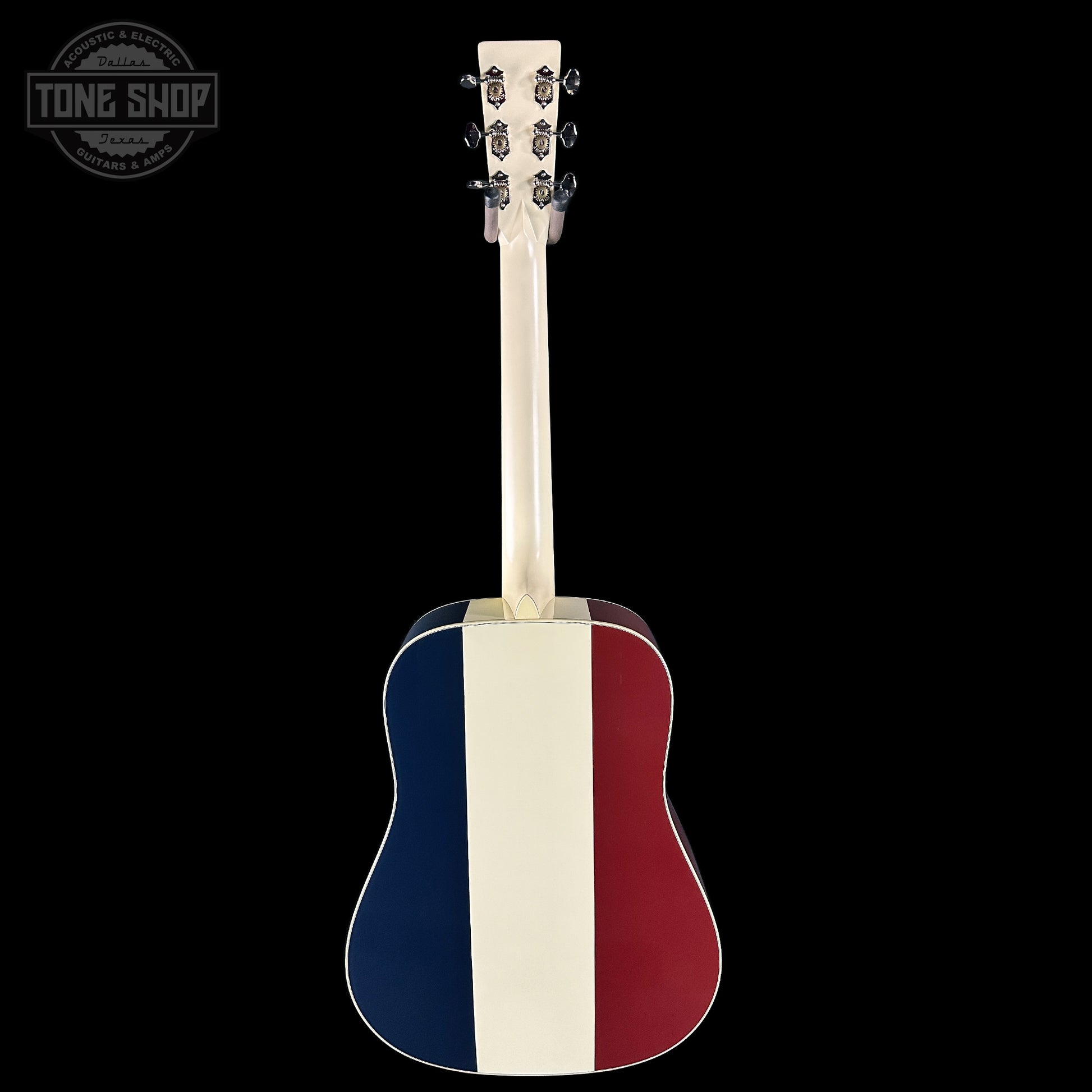 Acoustic guitar with a red, white, and blue striped design on a black background