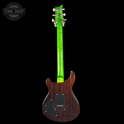 Electric guitar with a green pickguard on a black background, featuring the Tone Shop logo.