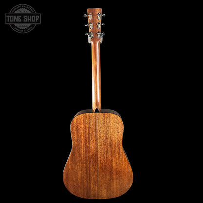 Acoustic guitar with a visible brand logo on a black background