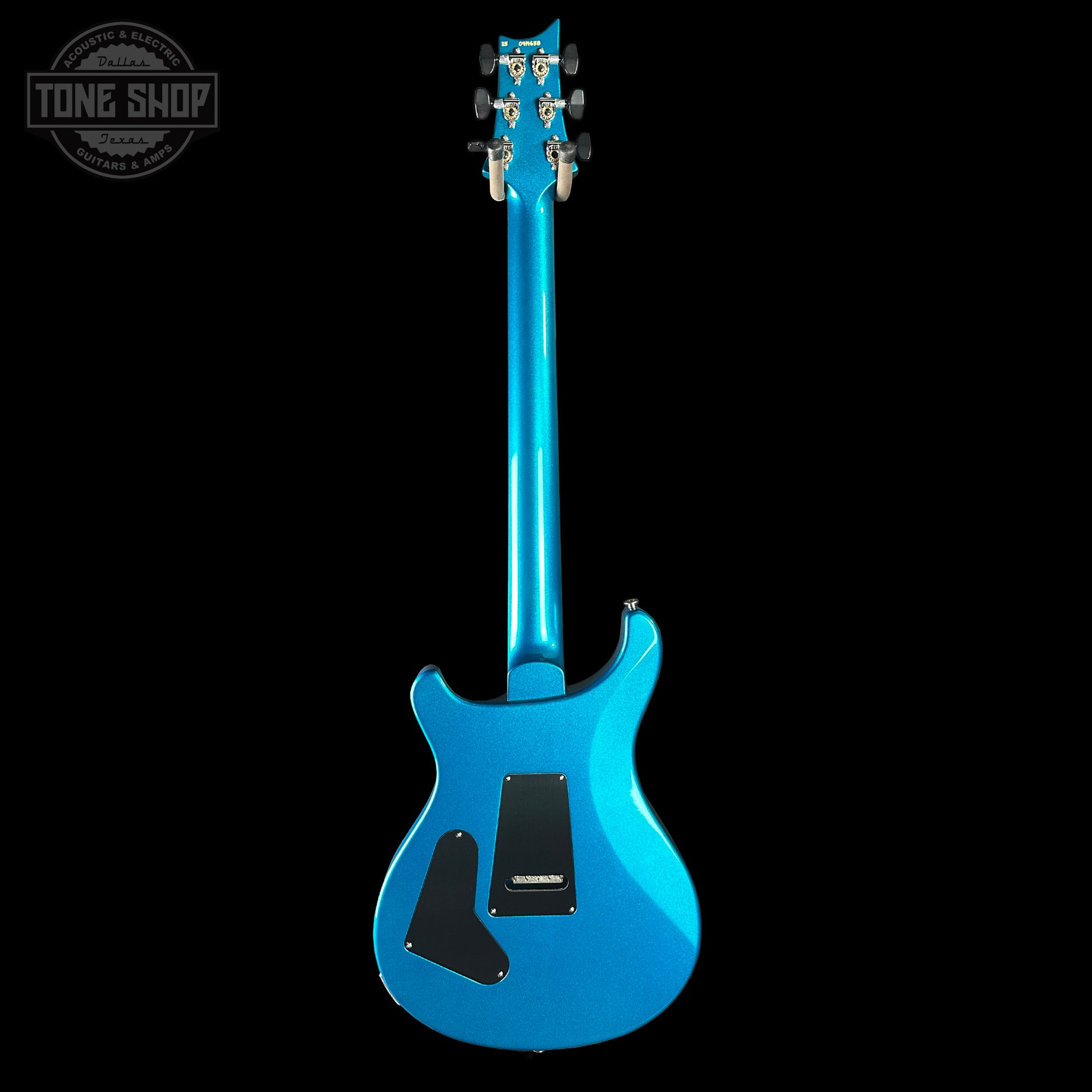 Blue electric guitar on a black background with 'Tone Shop' logo.
