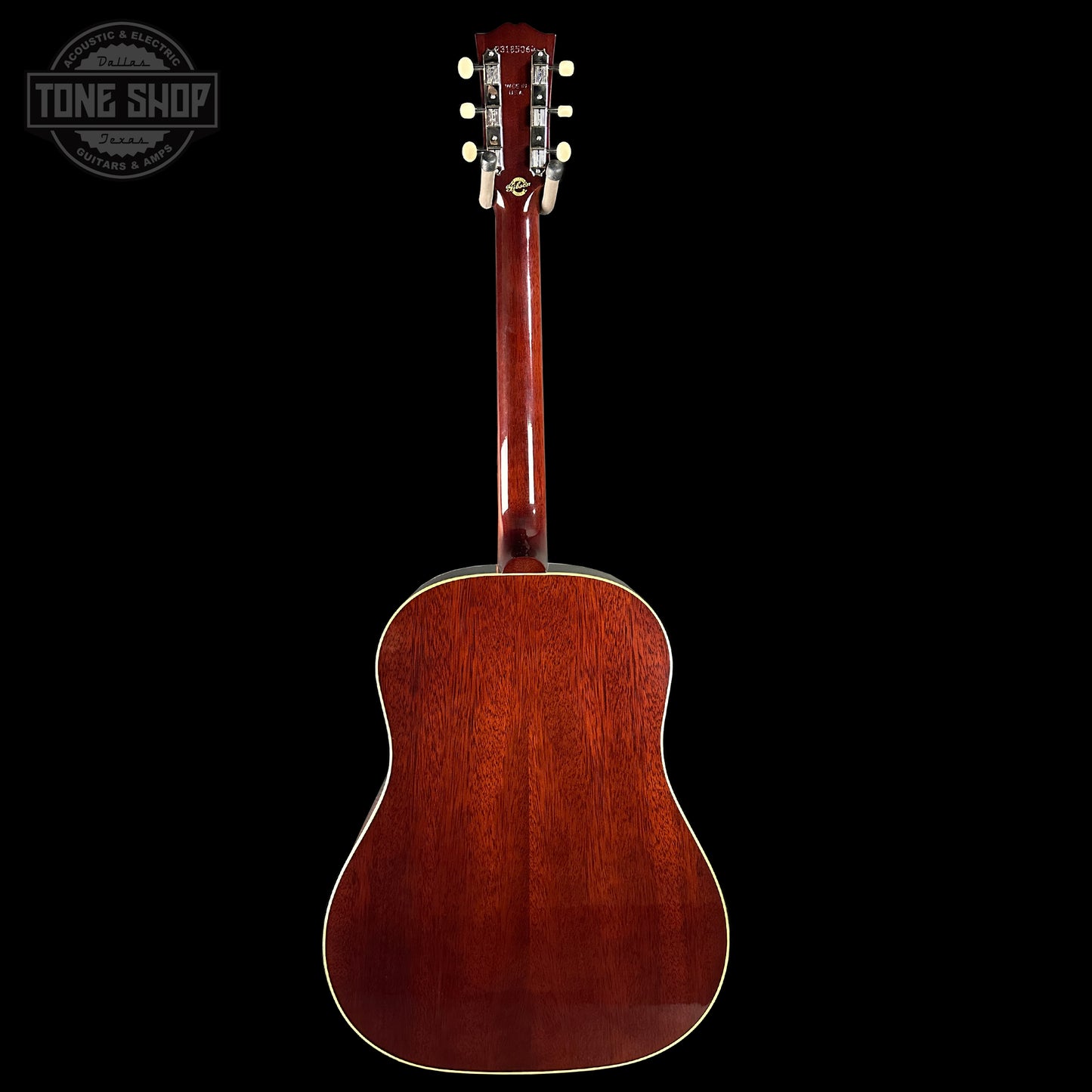 Back view of a wooden acoustic guitar on a black background with 'Tone Shop' logo.