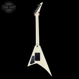 White flying-V guitar on a black background with 'Tone Shop' logo.