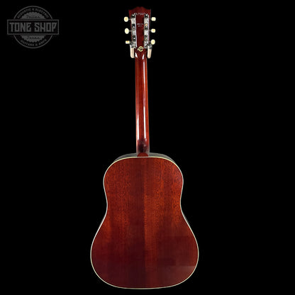Back view of a brown acoustic guitar on a black background with 'Tone Shop' logo.