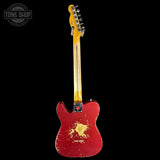 Red electric guitar with a worn finish on a black background, featuring 'Tone Shop' logo.