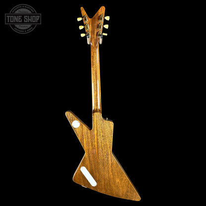 Wooden electric guitar on a black background with 'Tone Shop' logo.