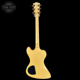 Gold electric guitar on a black background with 'Tone Shop' logo.