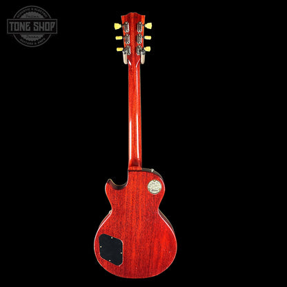 Red electric guitar on a black background with 'Tone Shop' logo.
