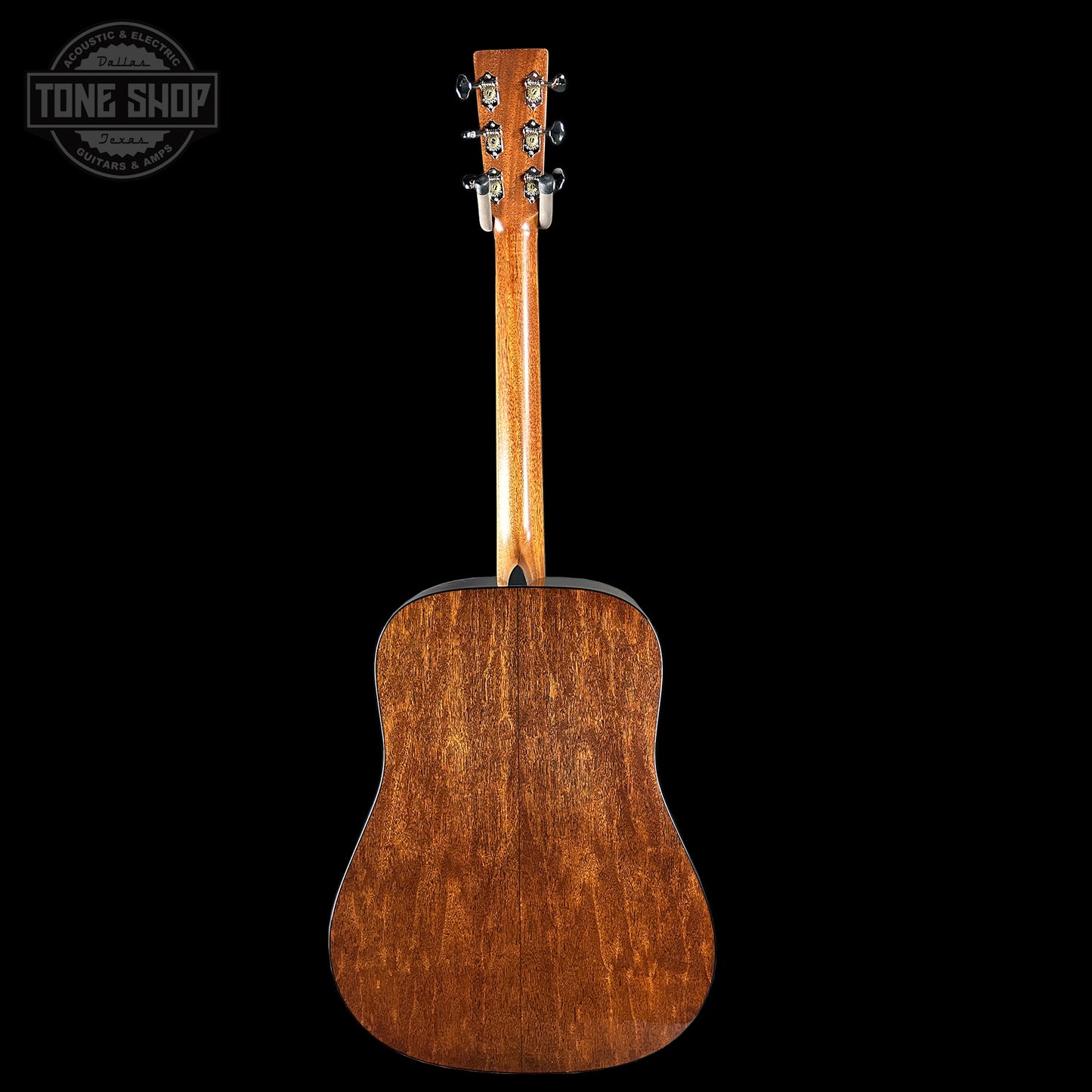 Back view of a wooden acoustic guitar 