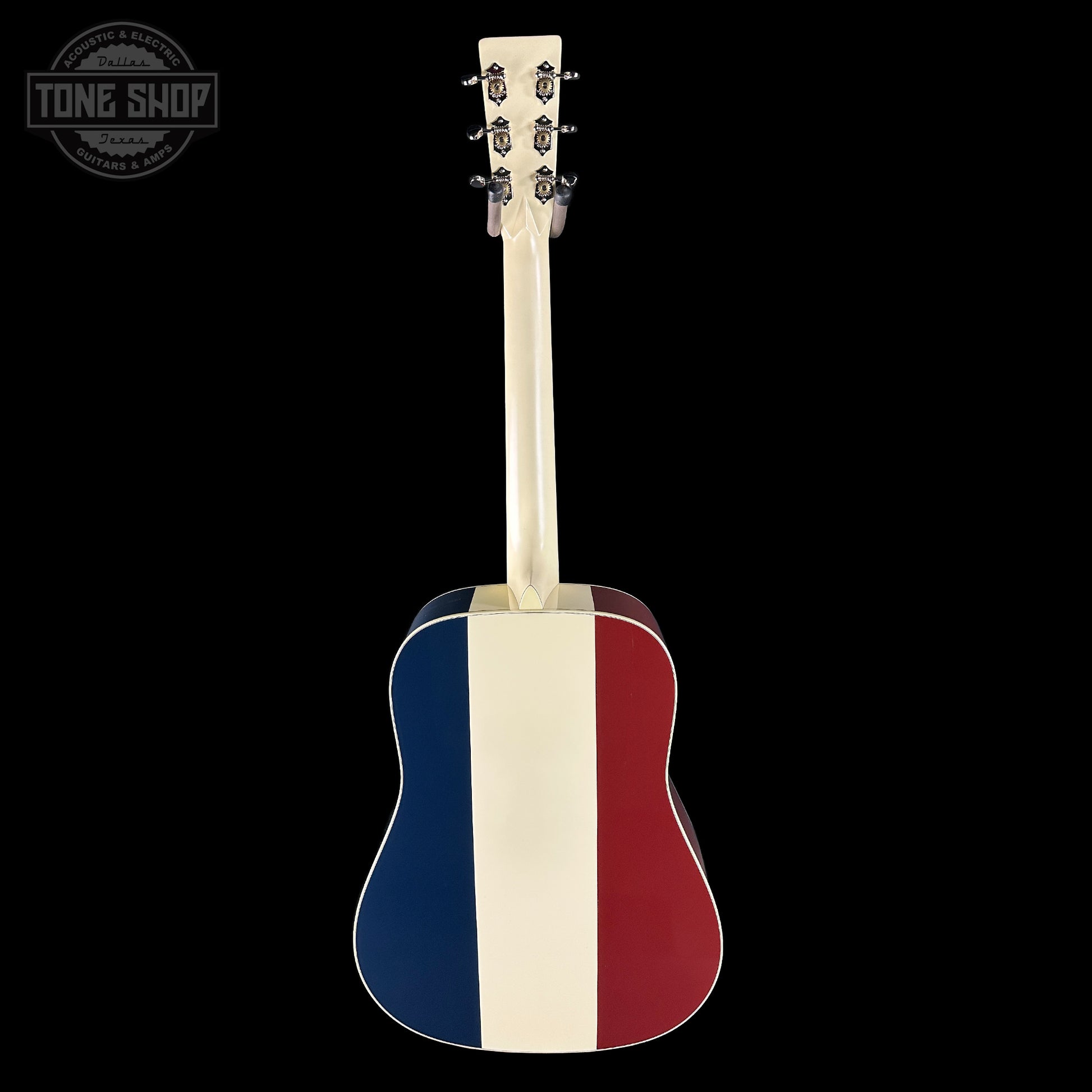 Acoustic guitar with a red, white, and blue striped design on a black background
