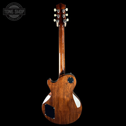 Wooden electric guitar with a visible brand logo on a black background