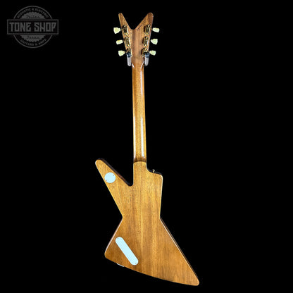 Wooden electric guitar with a unique design on a black background, featuring the 'Tone Shop' logo.
