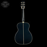 Acoustic guitar on a black background with 'Tone Shop' logo.