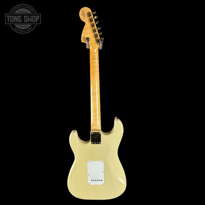 Beige electric guitar on a black background with 'Tone Shop' logo.