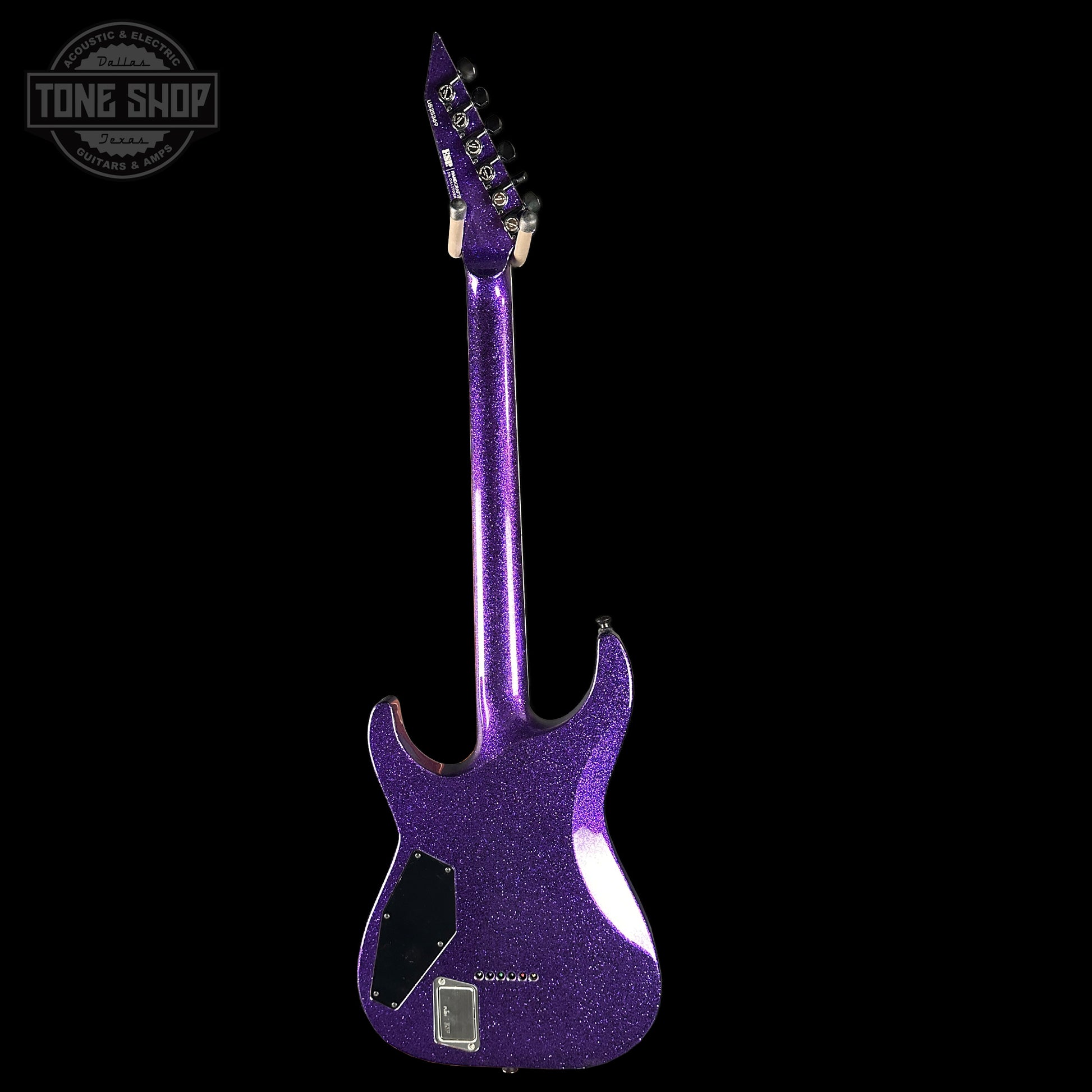 Purple electric guitar on a black background with 'Tone Shop' logo.