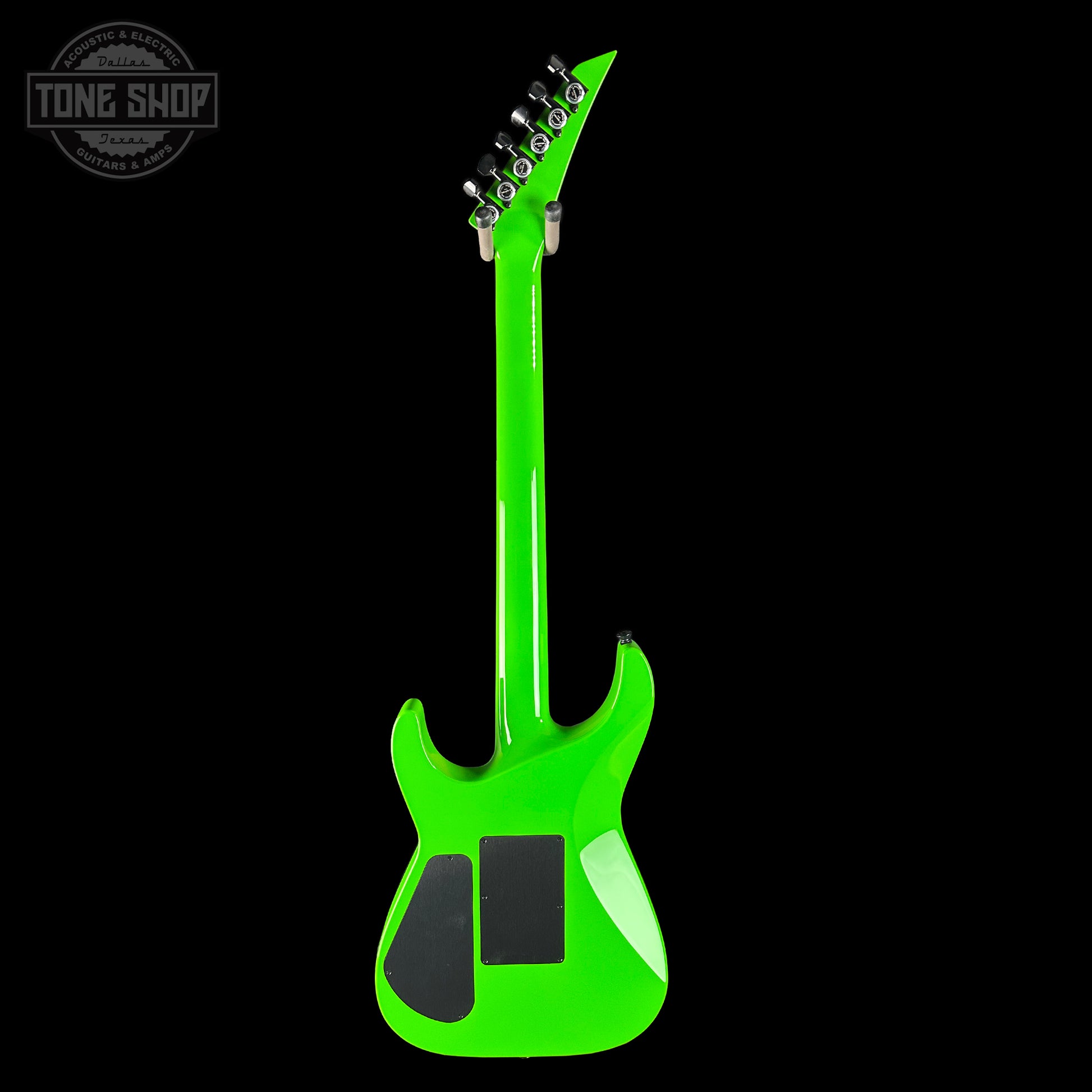 Green electric guitar on a black background with 'Tone Shop' logo.