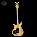 Wooden electric guitar on a black background with 'Tone Shop' logo.