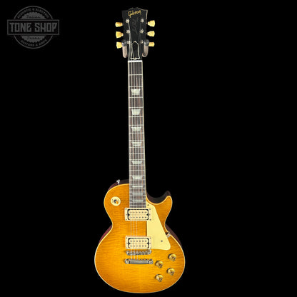 Electric guitar with a sunburst finish on a black background, featuring the Tone Shop logo.