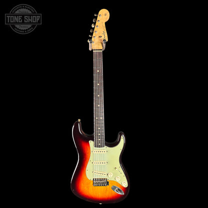 Electric guitar with a sunburst finish on a black background, featuring the Tone Shop logo.